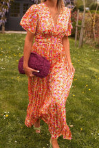 Lilia | vestido largo floral con falda plisada — Naranja floral