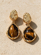 Aretes de broquel o de gota, vista frontal
