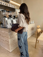Blusa de lino con dobladillo deshilachado, color beige, vista trasera