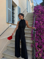 Jumpsuit largo de pierna ancha con cintura marcada, color negro, vista frontal