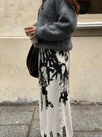 Pantalón palazzo con estampado botánico, color blanco, vista lateral